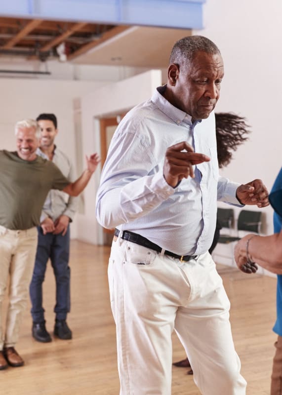 a group of people dancing in a dance studio