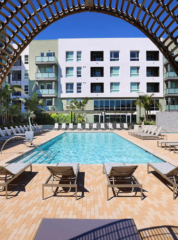 Park on First Apartments Pool Area with Lounge Chairs and Gazebo