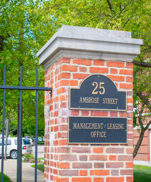 a brick pillar with a sign that reads 25 anderson street