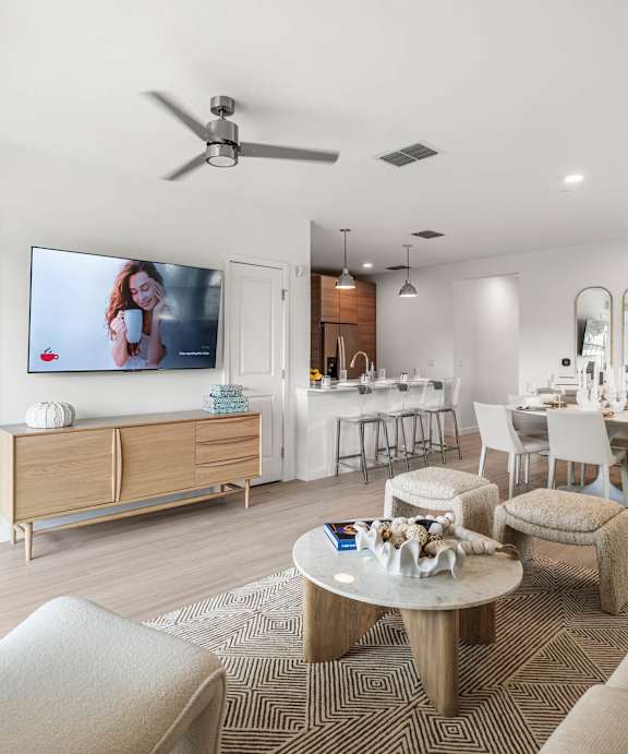 A dining room with a round table and chairs. at Altis Twin Lakes Apartments, Kissimmee, FL 34744