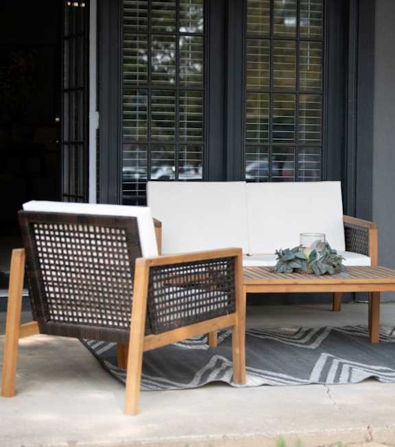 A patio with a white couch at The Addison at Collierville Apartments, Tennessee, 38017