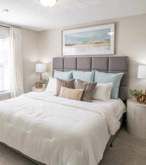 A bedroom with a large bed at The Addison at Collierville Apartments, Collierville, 38017