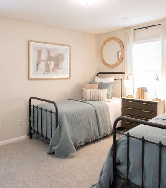 A bedroom with two beds at The Addison at Collierville Apartments, Collierville, Tennessee