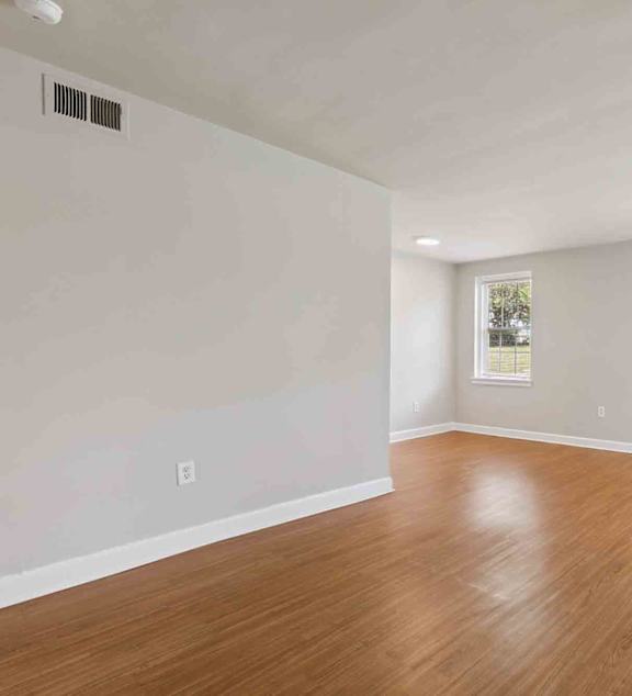 Woodside Place Apartments in Silver Spring, MD Living Room and Hallway to Bedroom