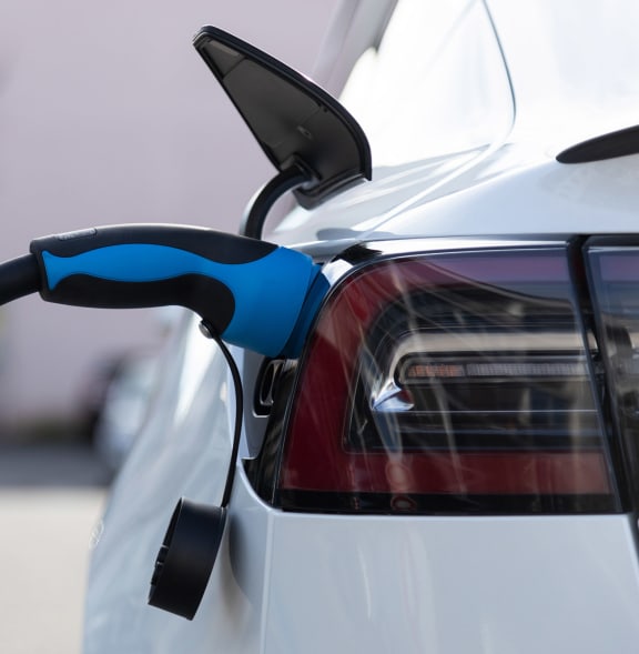 a electric car is plugged into a charging station
