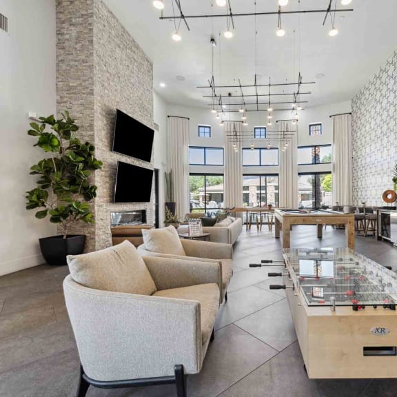 a large living room with multiple couches and a coffee table