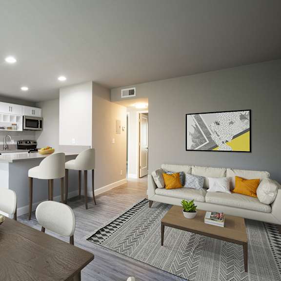 A modern living room with a dining table and chairs.