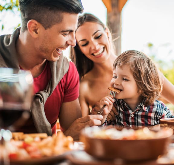 a family eating a meal at a restaurant  at VORA LUX, CA 92120
