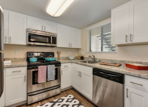 Kitchen with Granite Counters at Rush River Apartments, Sacramento