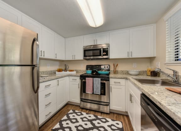 Kitchen with Wood Floor at Rush River Apartments, California