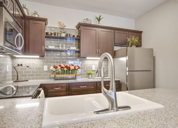 a kitchen with a sink and a refrigerator