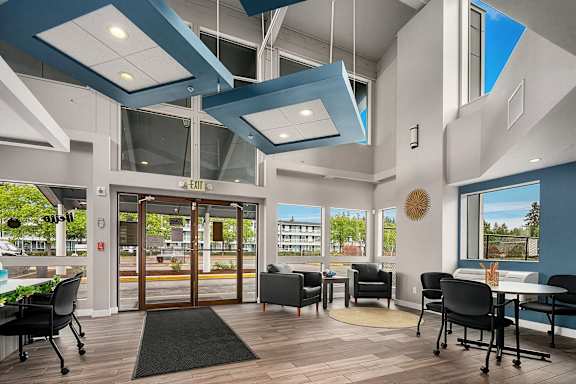 A modern office space with a view of the outside.