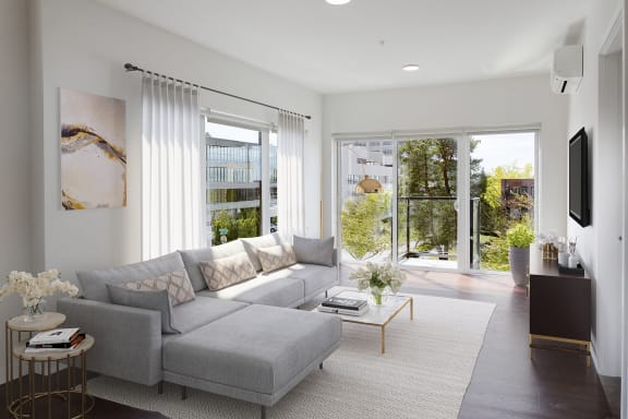 a living room with a gray couch and a coffee table