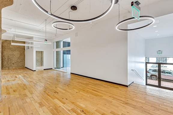 A room with wooden floors and white walls.