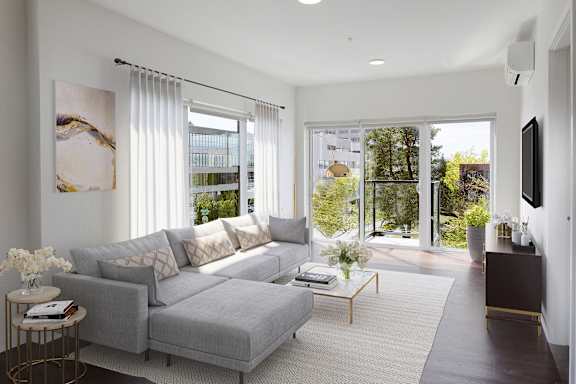 a living room with a gray couch and a coffee table