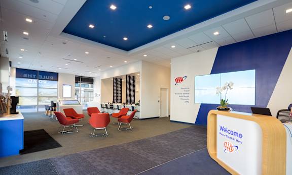 A reception area with a blue and white color scheme and a welcome sign.