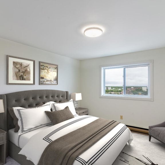 a bedroom with a bed and a chair in a room