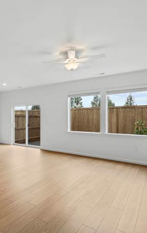 a bedroom with a large window and a closet