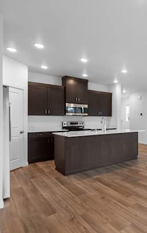 a kitchen with a large island in the middle of it