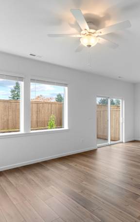 a bedroom with a large window and a closet