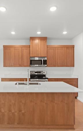 a kitchen with a large island in the middle of it