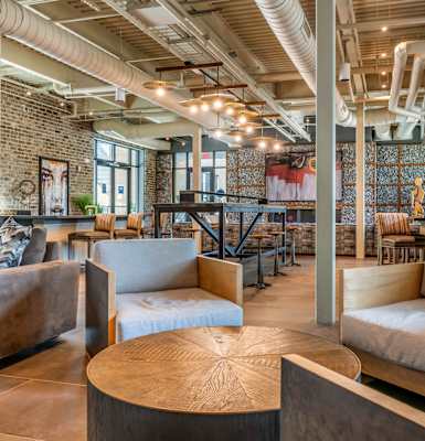 A large room with a lot of chairs and tables. at JTB Apartments, Jacksonville, FL, 32256