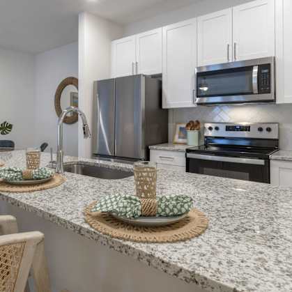 a kitchen with a granite counter top and a sink