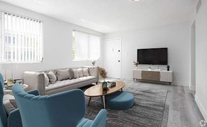 a living room with couches a coffee table and a television