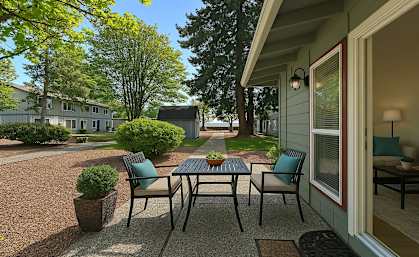 A patio with a table and chairs is shown.