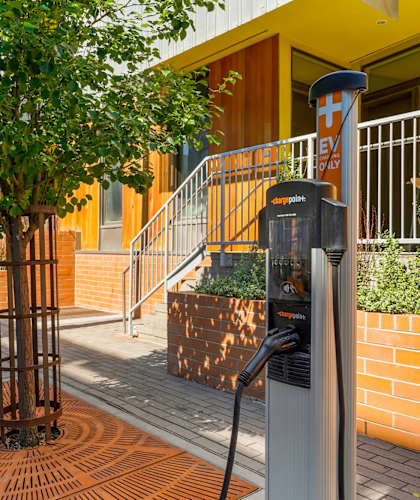 an electric car charger in front of a building