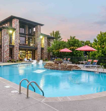 A large house with a pool in the backyard.