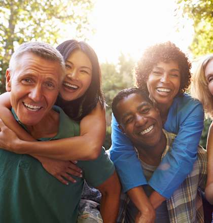 a group of people smiling and posing for a picture
