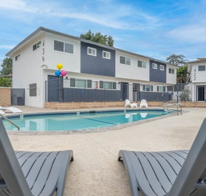 a house with a swimming pool in front of it