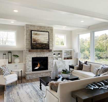 a living room with a fireplace and couches