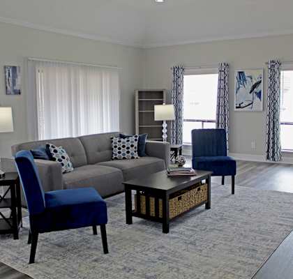 Living Room with a Couch and Chair at Woodland Villas Apartments in Jasper, AL