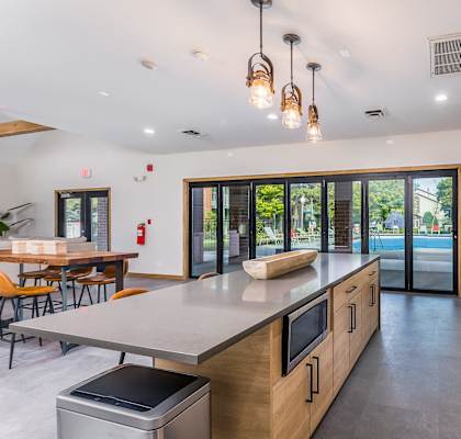 A modern kitchen with wooden cabinets and stainless steel appliances.