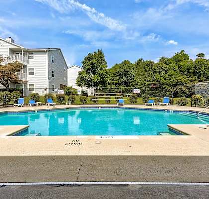 A swimming pool with the words at Sedgefield Square Apartments, North Carolina, 27407
