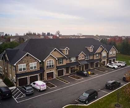 an aerial view of a large building with a parking lot