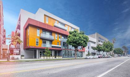 a rendering of a building on a city street