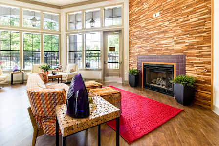 resident clubhouse with an internet café and cozy fireplace