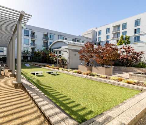 a backyard with a lawn and a table and chairs at Strata at Mission Bay, California, 94158