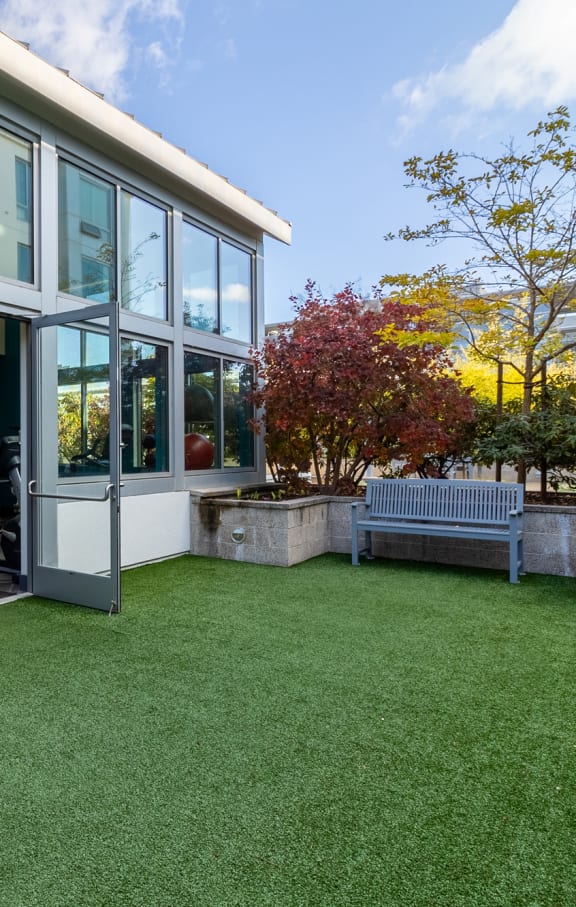 strata gym with outdoor green space and bench at Strata at Mission Bay, San Francisco, CA, 94158
