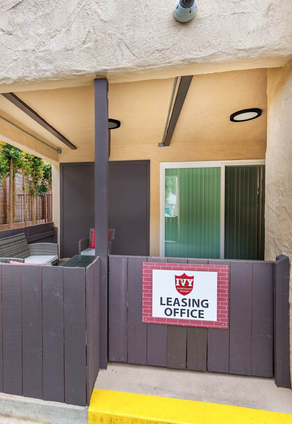 A leasing office is located under a covered walkway.