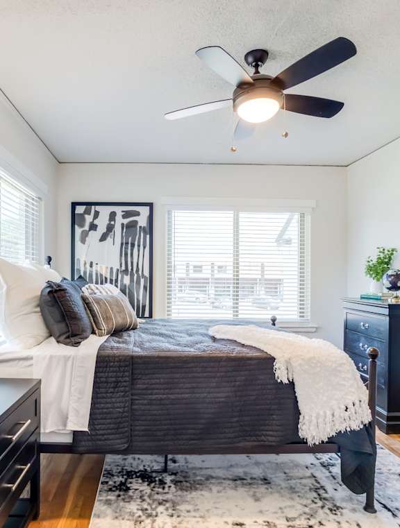an empty living room with wood floors and white walls at Kiwi Goji Apartments, TN, 38111