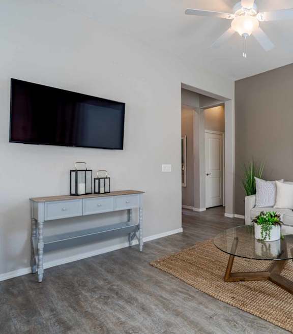 A modern kitchen with white cabinets and stainless steel appliances. at Vistoria At Stadium Apartments, Glendale, Arizona