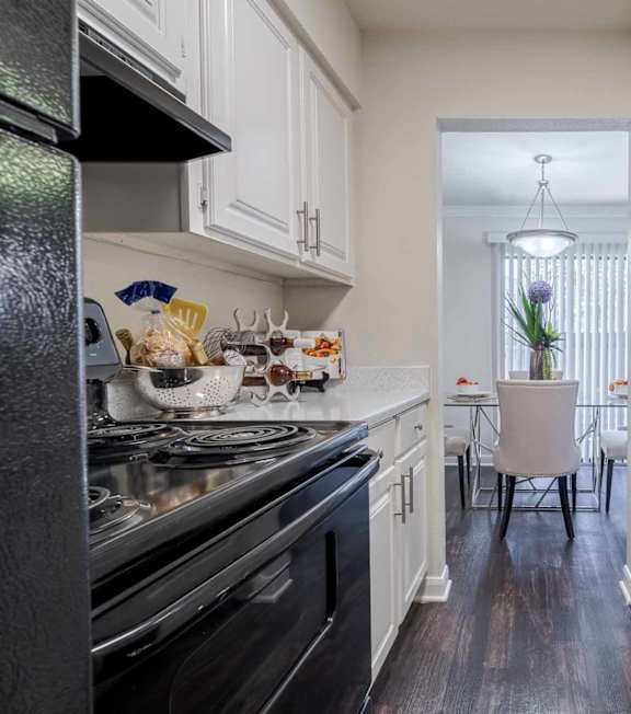 Clubroom Kitchen and Dining Room with Stools and Chairs at 2400 Briarwest Apartments, Houston, TX, 77077