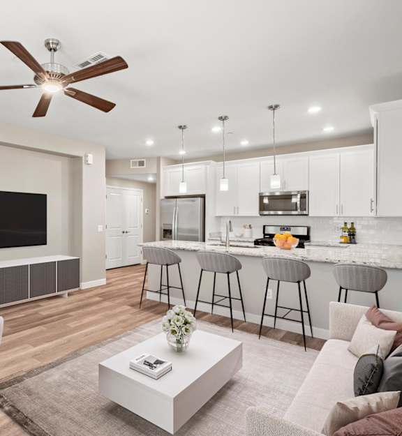 Living room and kitchen at Bella Victoria Luxury Apartments in Mesa AZ