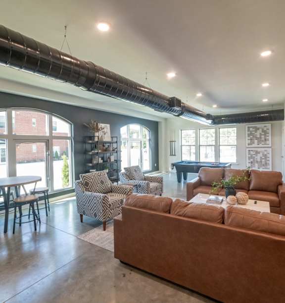 a kitchen with a marble counter top and a stainless steel refrigerator at The Beck at Hidden River, Tampa, FL, 33637