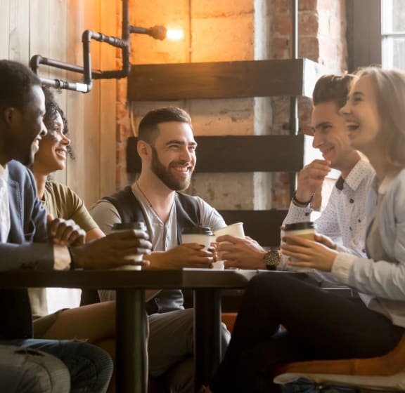 Group of Friends Having Coffee Together Smiling
