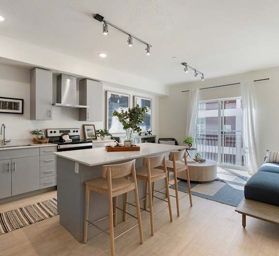 a kitchen and living room with a table and chairs at Paperbox Lofts, Utah